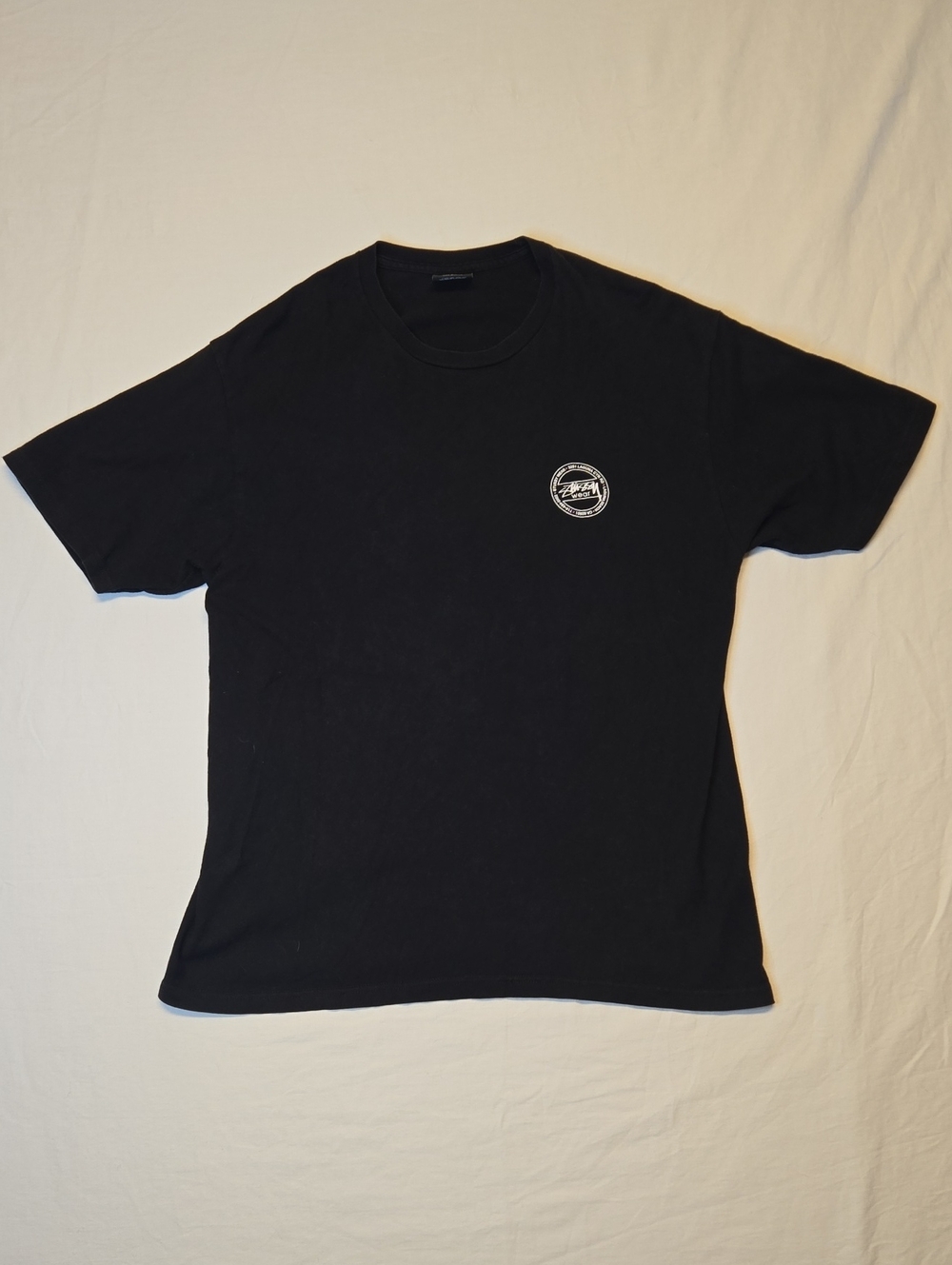 Stussy Black Short-Sleeve Graphic Crewneck T-Shirt with White Chest Emblem Y2K